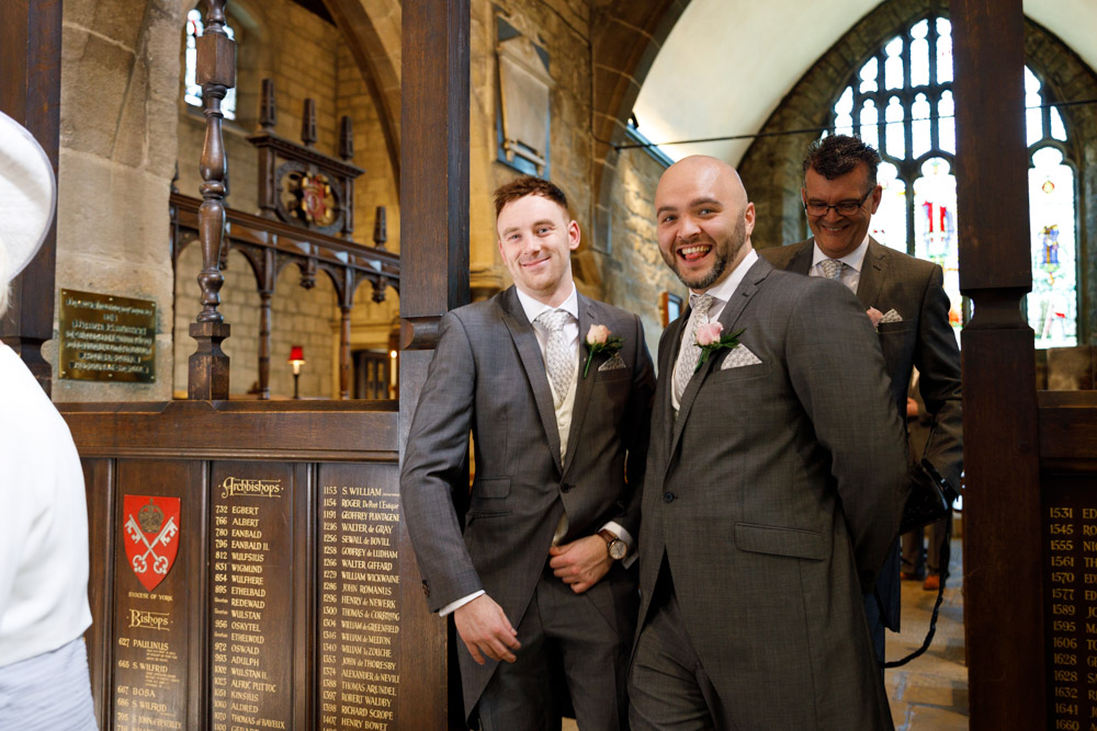 The best men lead the way out of the vestry, always ready with a smile.