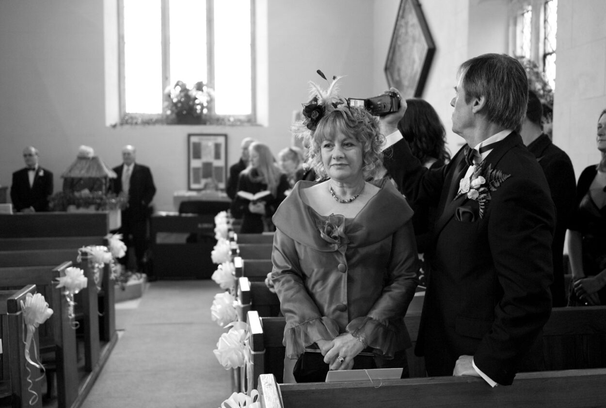 Guests wait outside the church for the bride’s arrival.