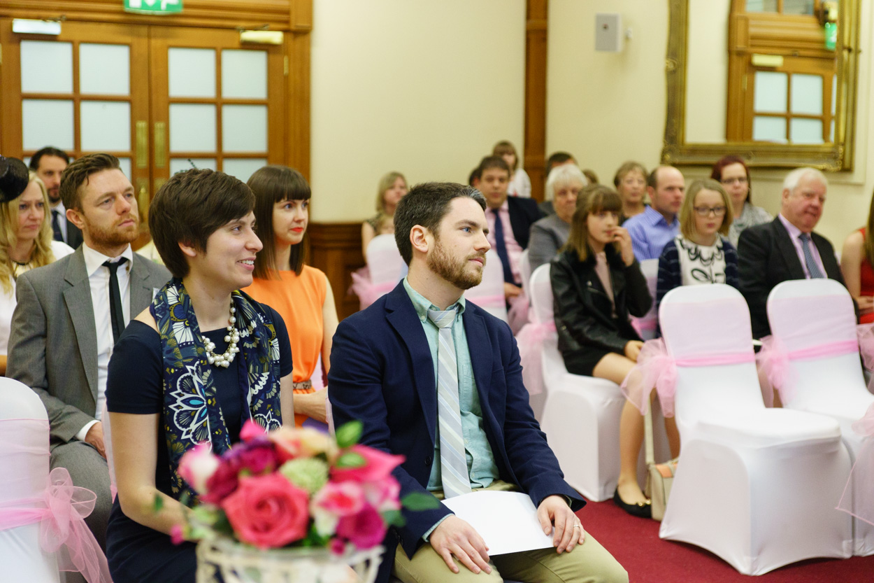 Guests watching the ceremony with focused expressions