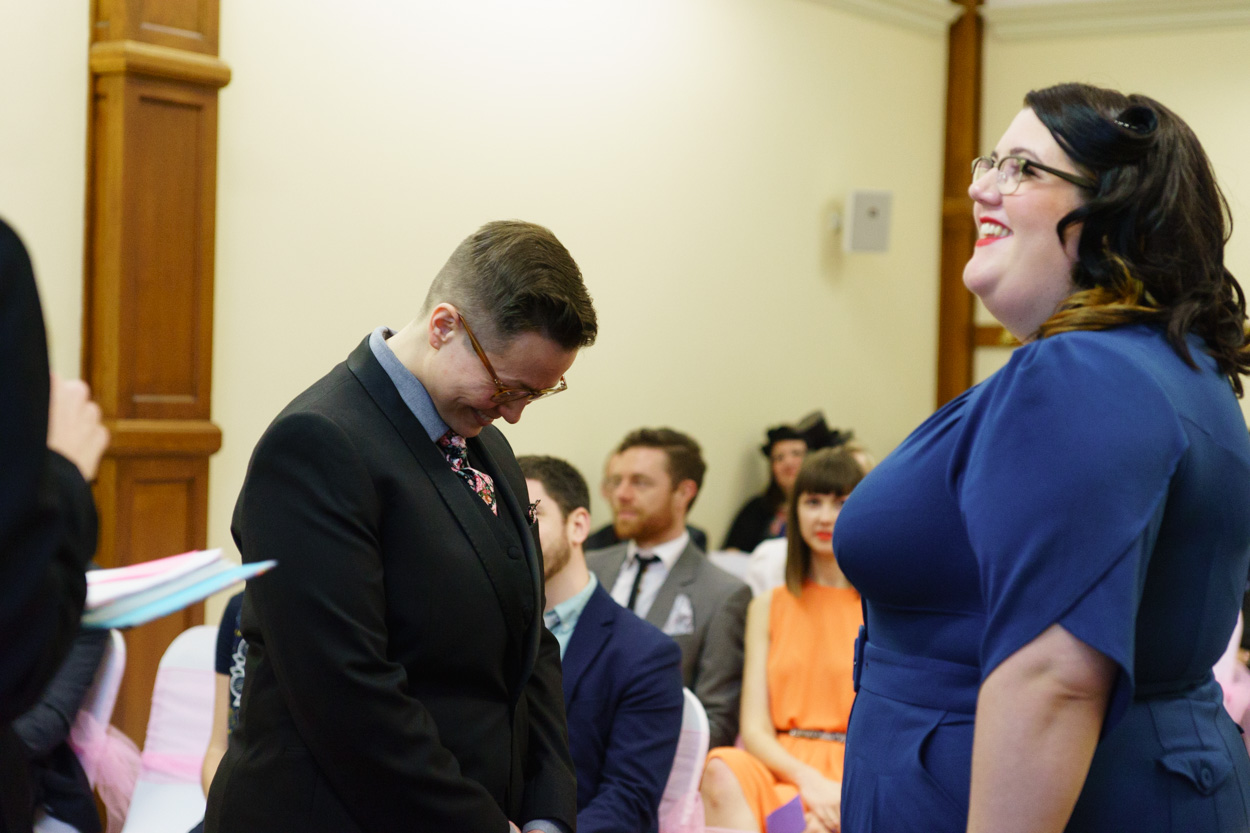 Registrar speaking as Lizzie and Tamara smile during the ceremony