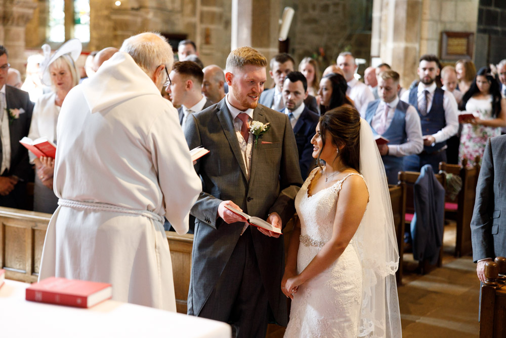 A closer view of Kyra and Matt exchanging a loving glance during the final hymn.