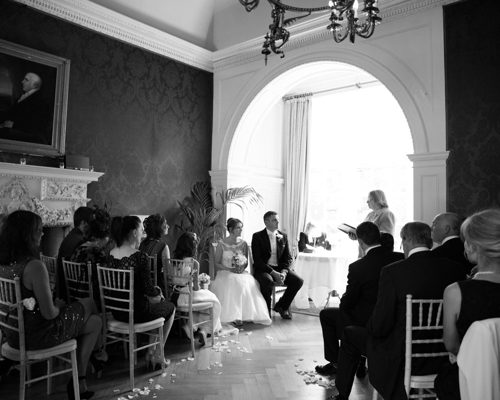 Wide shot as the registrar begins to speak during the Grays Court wedding ceremony.