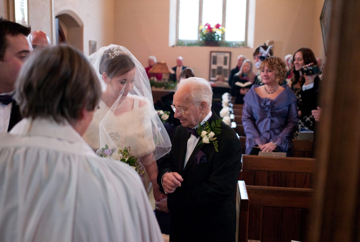 Grandad takes his seat as the couple arrives at the altar, photographed in my natural Yorkshire-inspired documentary style.