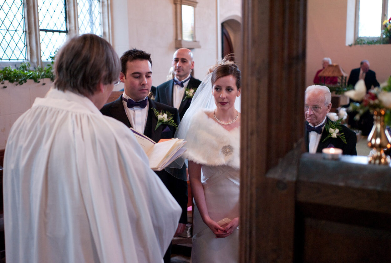 Quiet moment of the couple looking thoughtful during the ceremony.