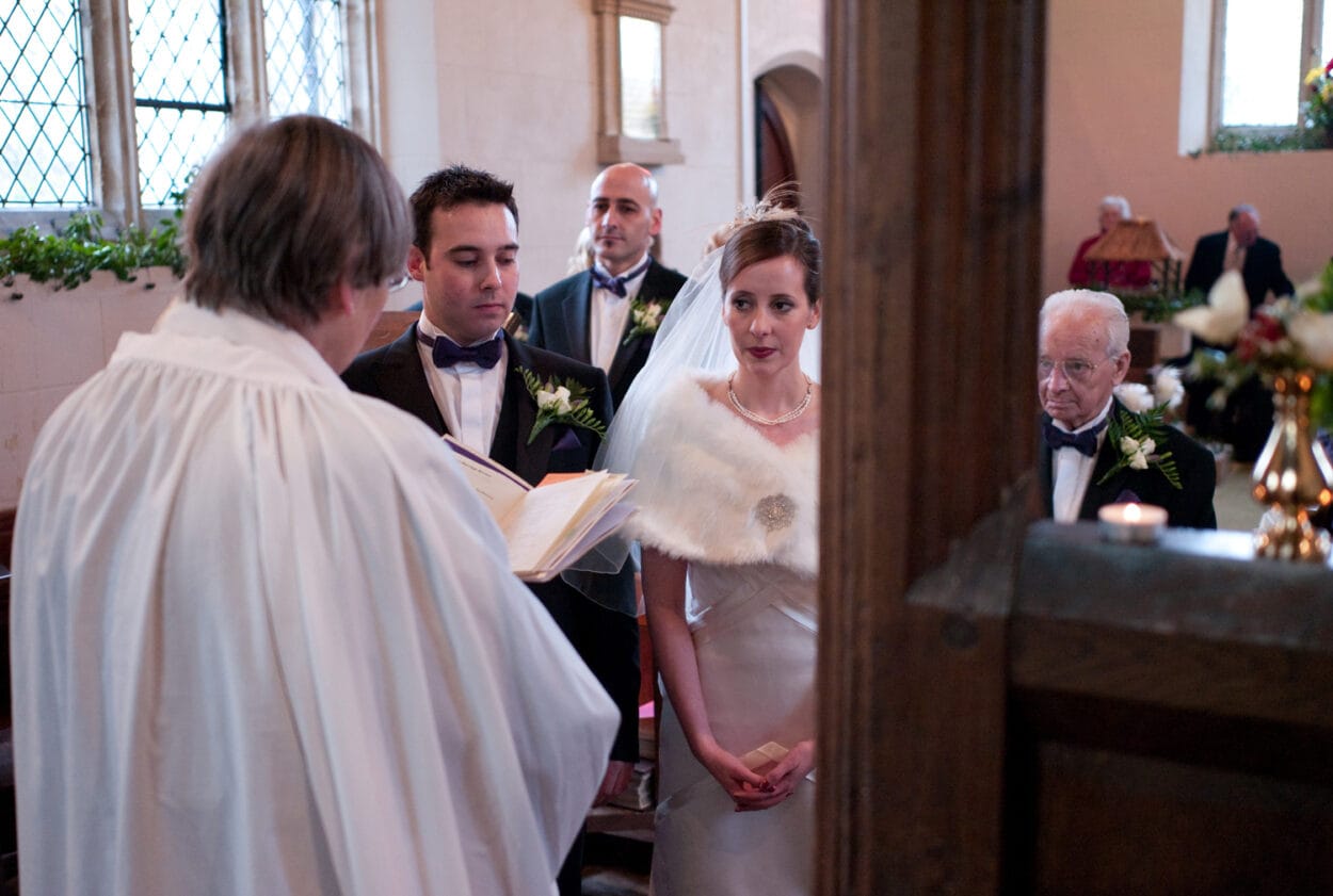 Quiet moment of the couple looking thoughtful during the ceremony.