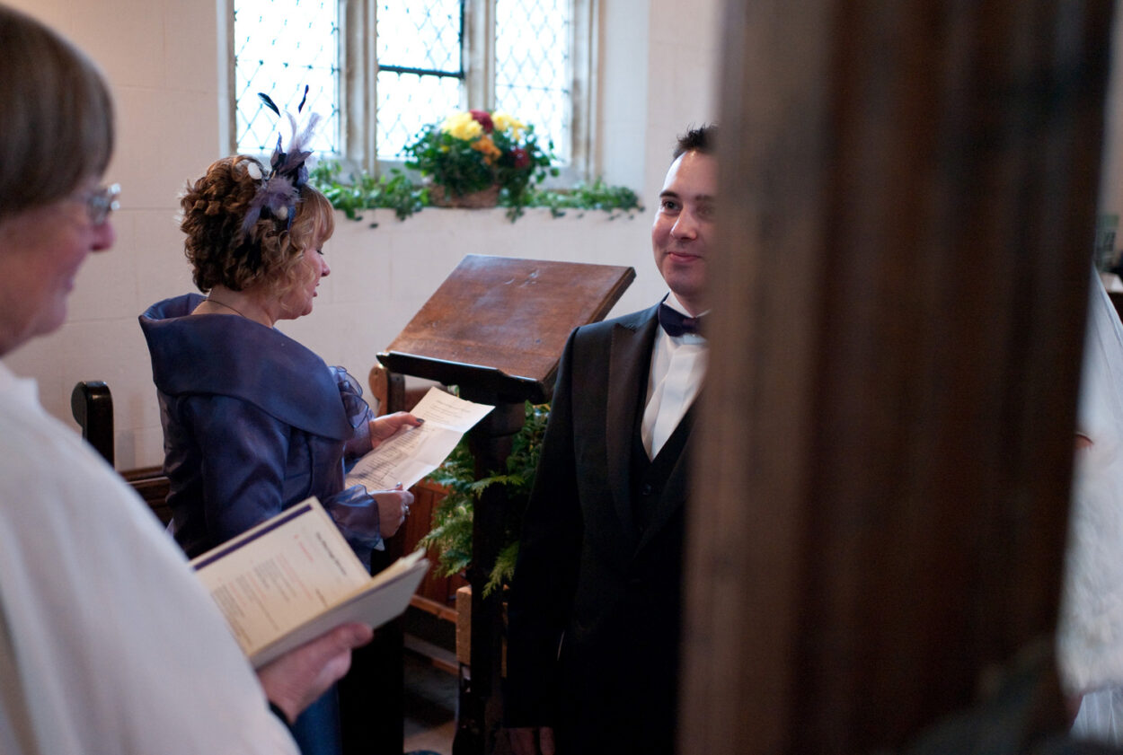 Emelie’s mum reads as the groom smiles softly. 
