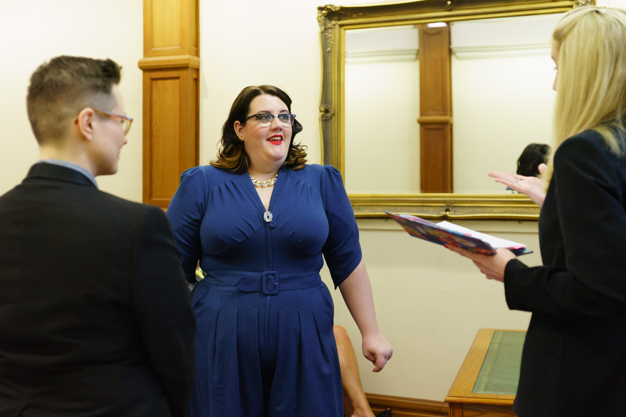 Couple listening happily as the registrar speaks