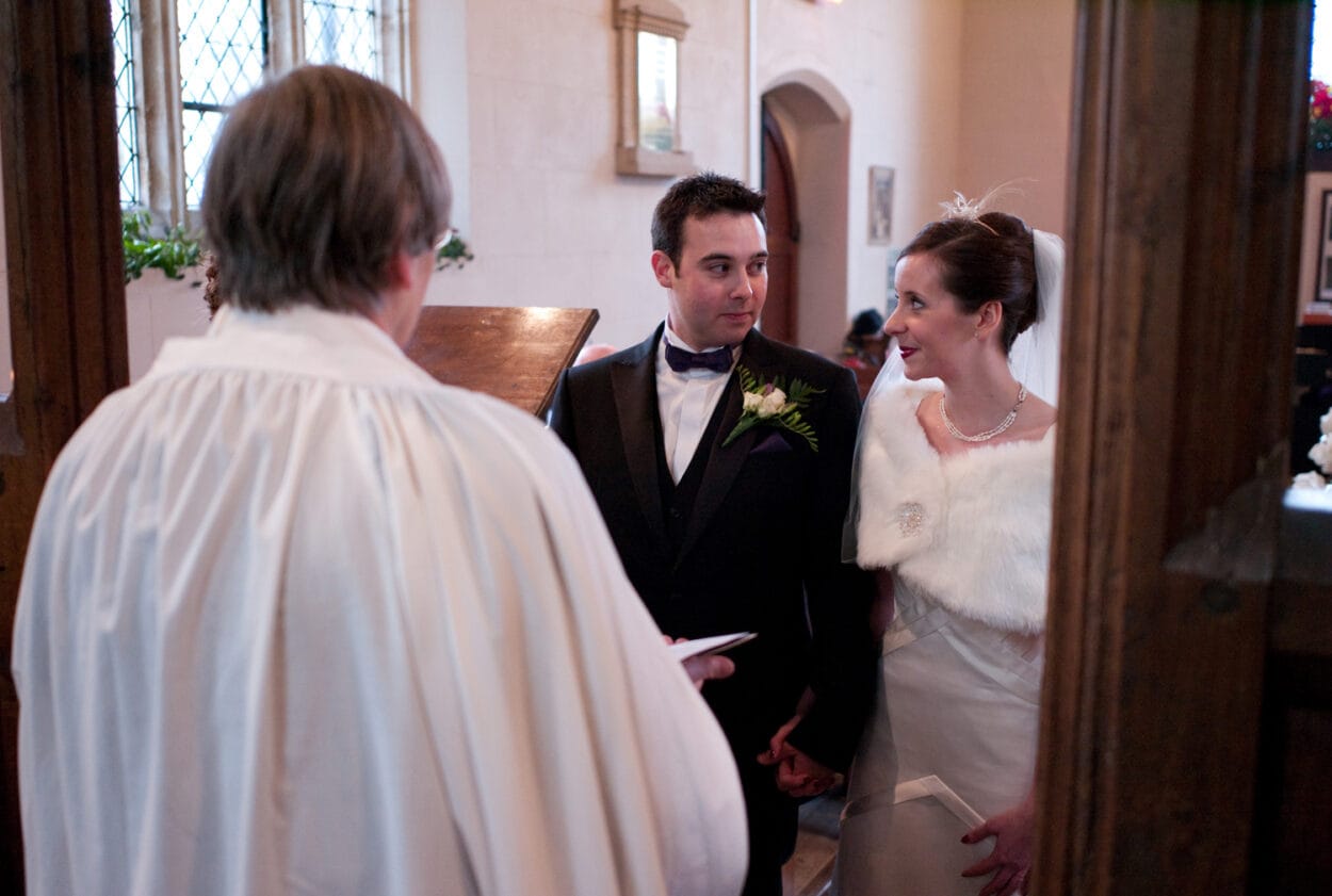 The couple look at each other — full of personality and connection.