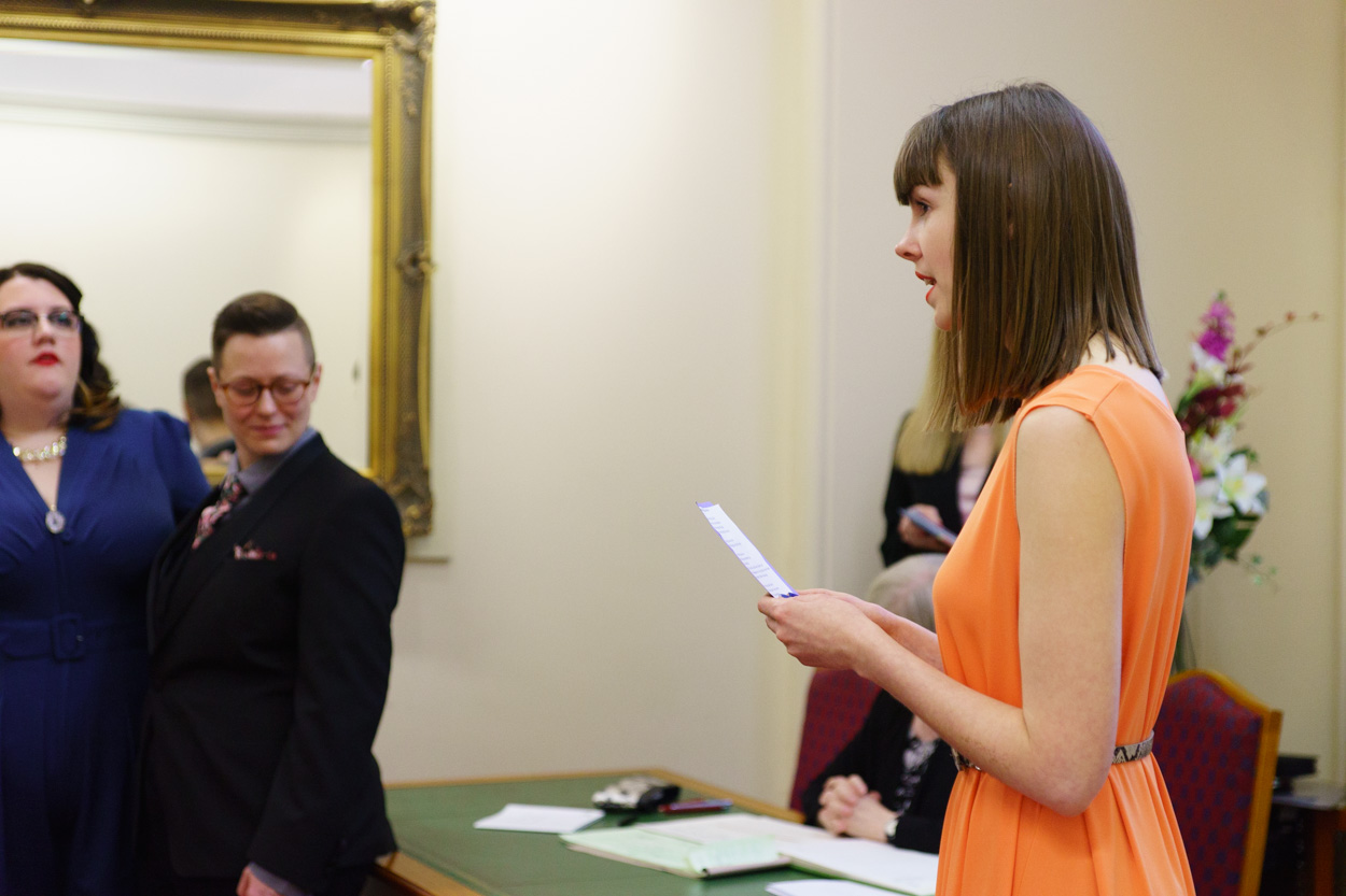 Couple smiling as the second reading begins