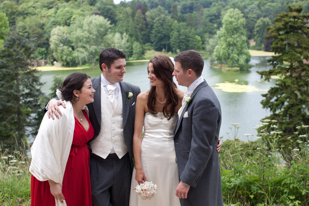 Couple with the best man and his girlfriend outdoors at the wedding