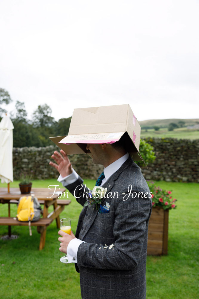 Funny rainy day moment at romantic Yorkshire wedding