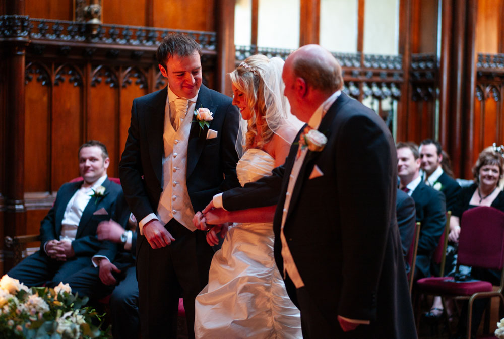 Father of the bride gently passes Vicky’s hand to Lee during the ceremony.