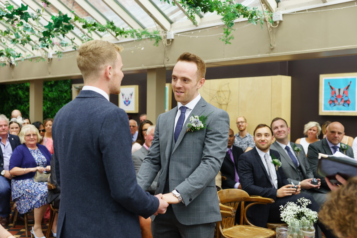 Christian and Jason saying their wedding vows