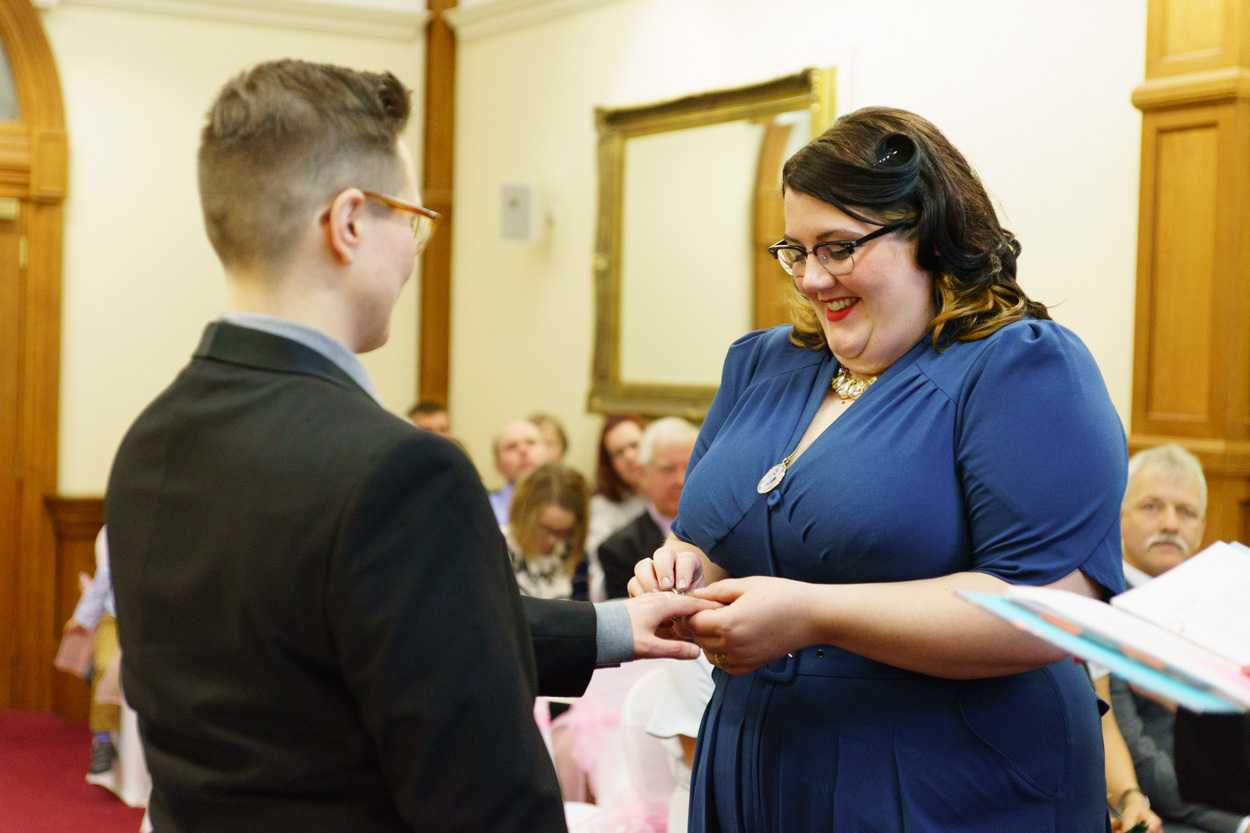 Lizzie placing the ring on Tamara’s finger