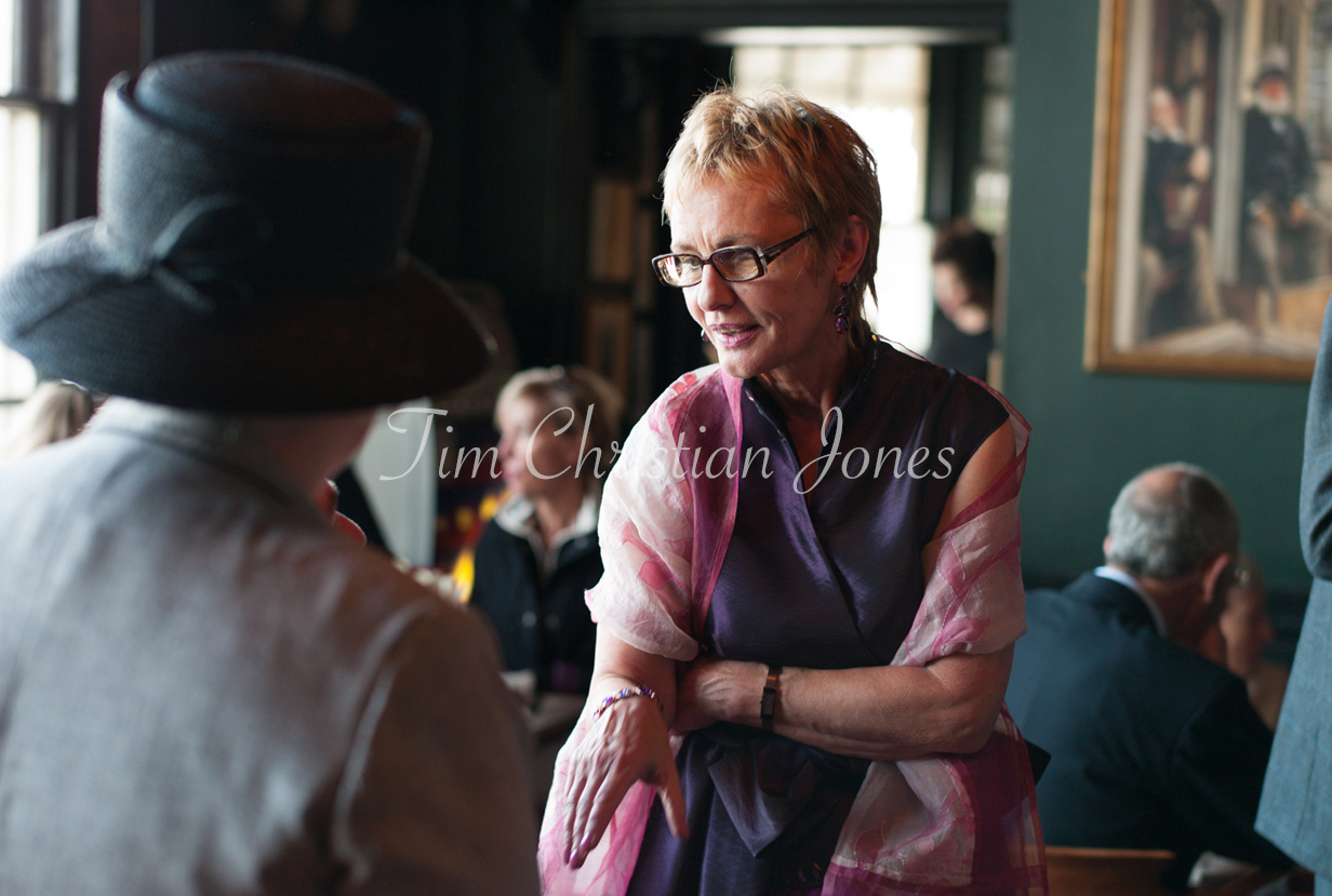 The groom’s mother chatting with friends and family before the ceremony at the Trafalgar Tavern.