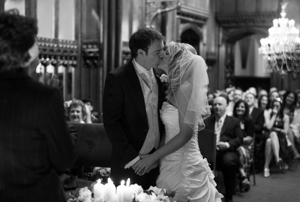 The couple’s first kiss, captured in black and white at their Allerton Castle ceremony.