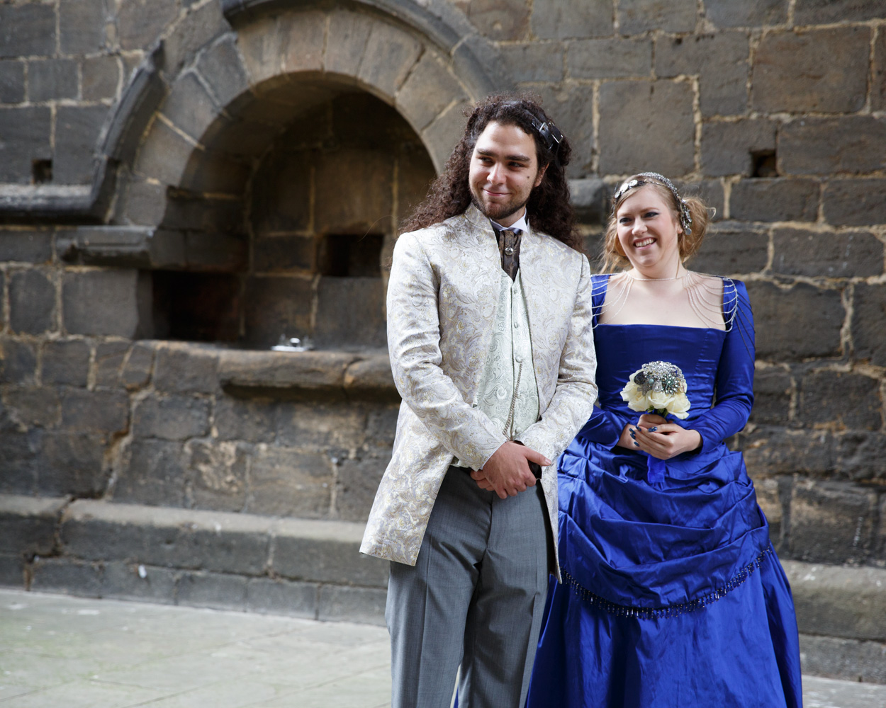 The couple react with shared smiles during the ceremony