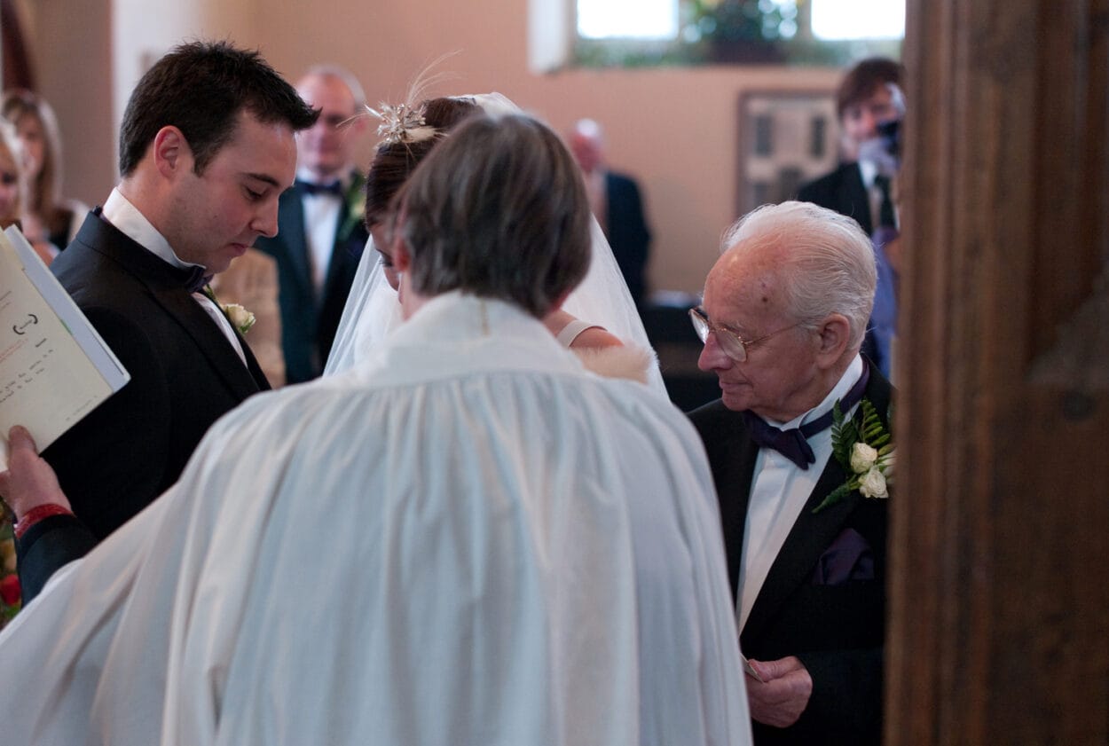 The ring ceremony begins in the tiny church.