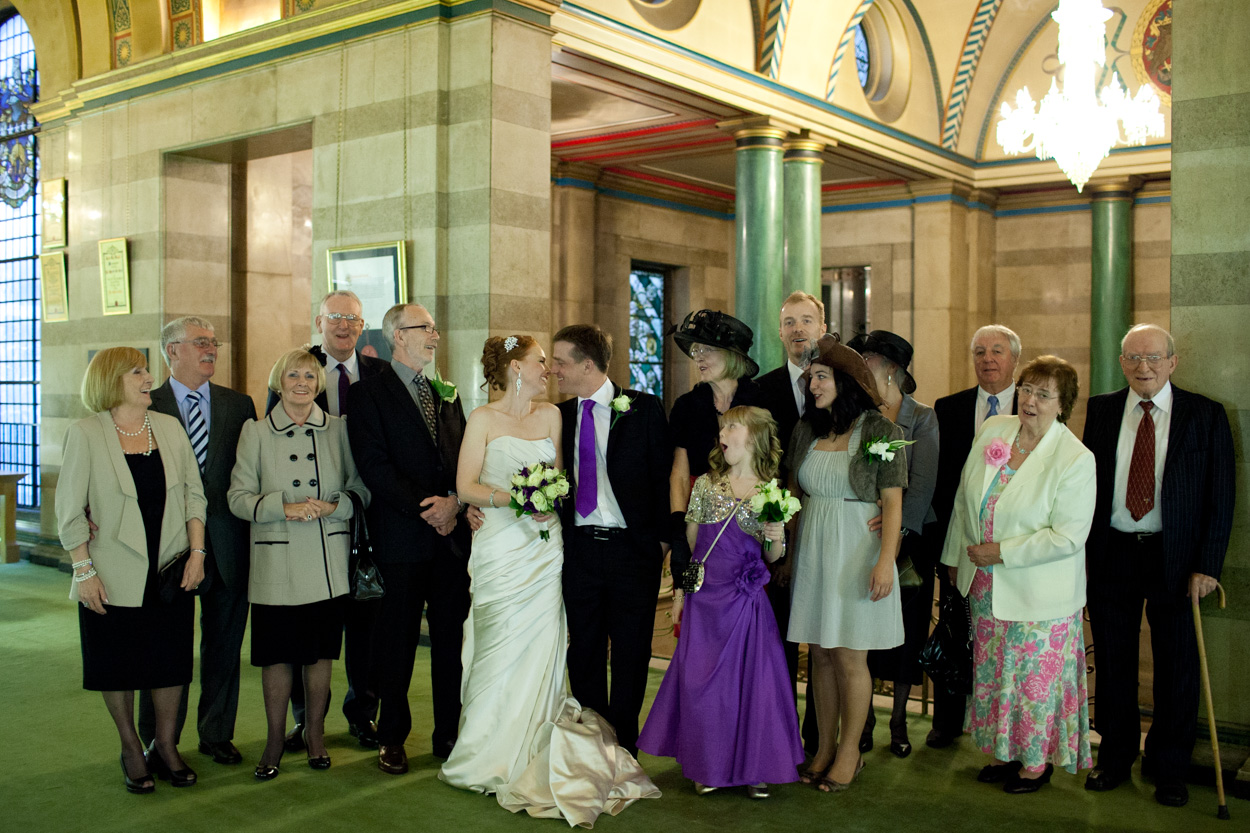 Group photo inside the Great Hall at Leeds Civic Hall, everyone gathered close to avoid the rain.