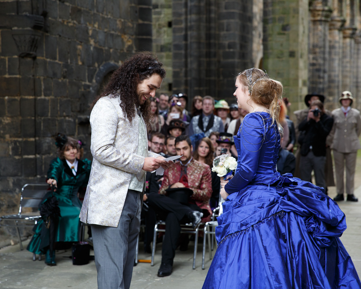 The groom reads his vows, focused and emotional