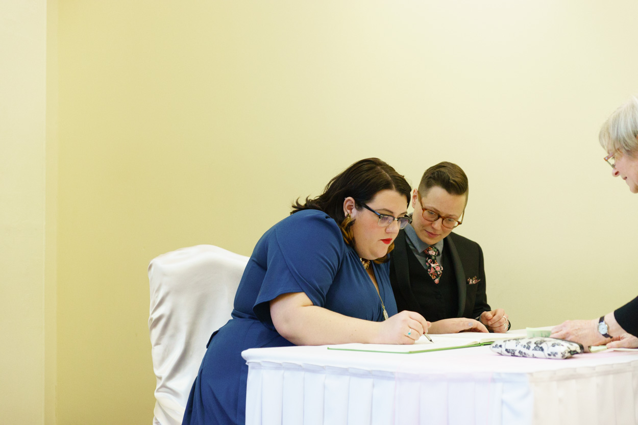 Lizzie signing the marriage register