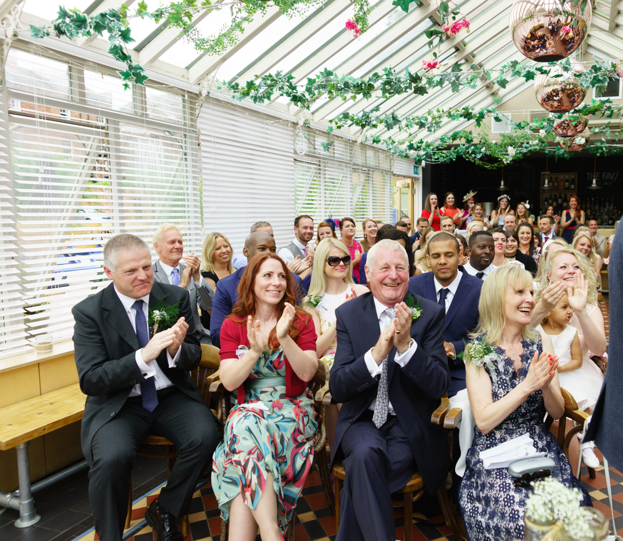 Applause from wedding guests after the ceremony