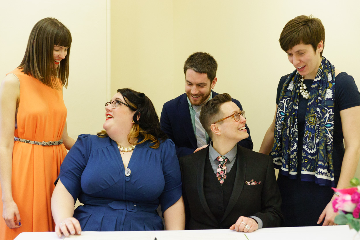 Readers and partners chatting with the couple after the ceremony
