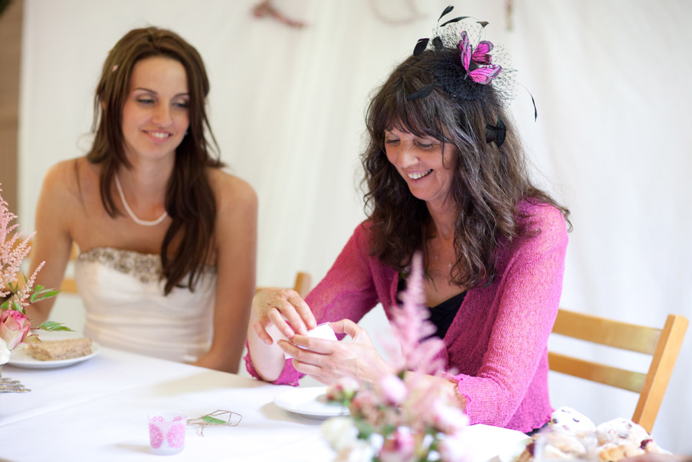 Bride and her mum smiling together during a relaxed West Yorkshire wedding reception