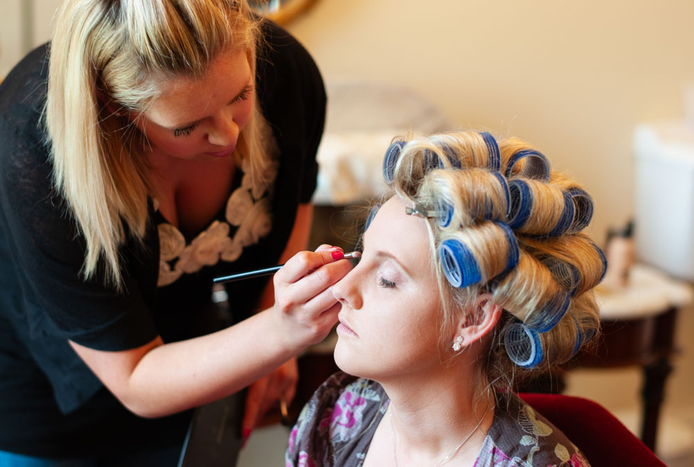 Allerton Castle in Yorkshire - the bride's makeup - hair in rollers
