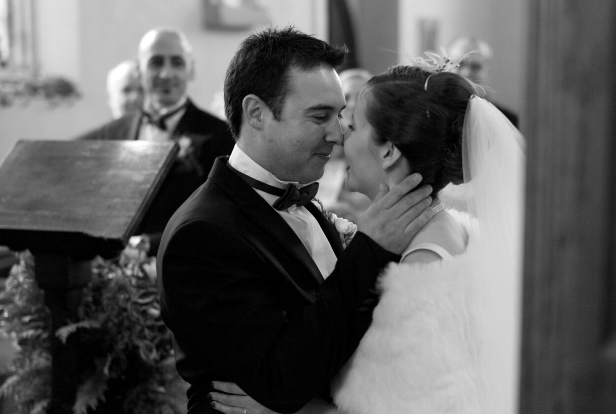 Nose-to-nose the couple smile in black and white, captured in my natural Leeds wedding photographer style.