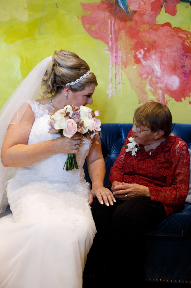 Tracy smiling with an elderly relative seated, a special moment captured