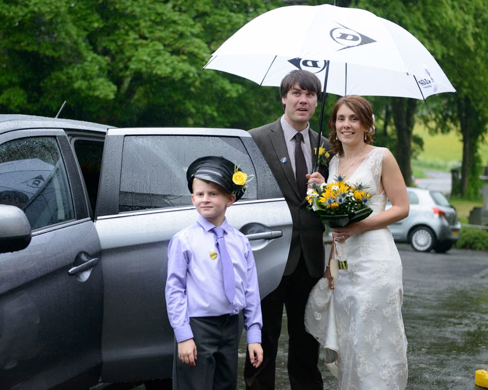 051 wedding car umbrellas st michael all angels susie dan