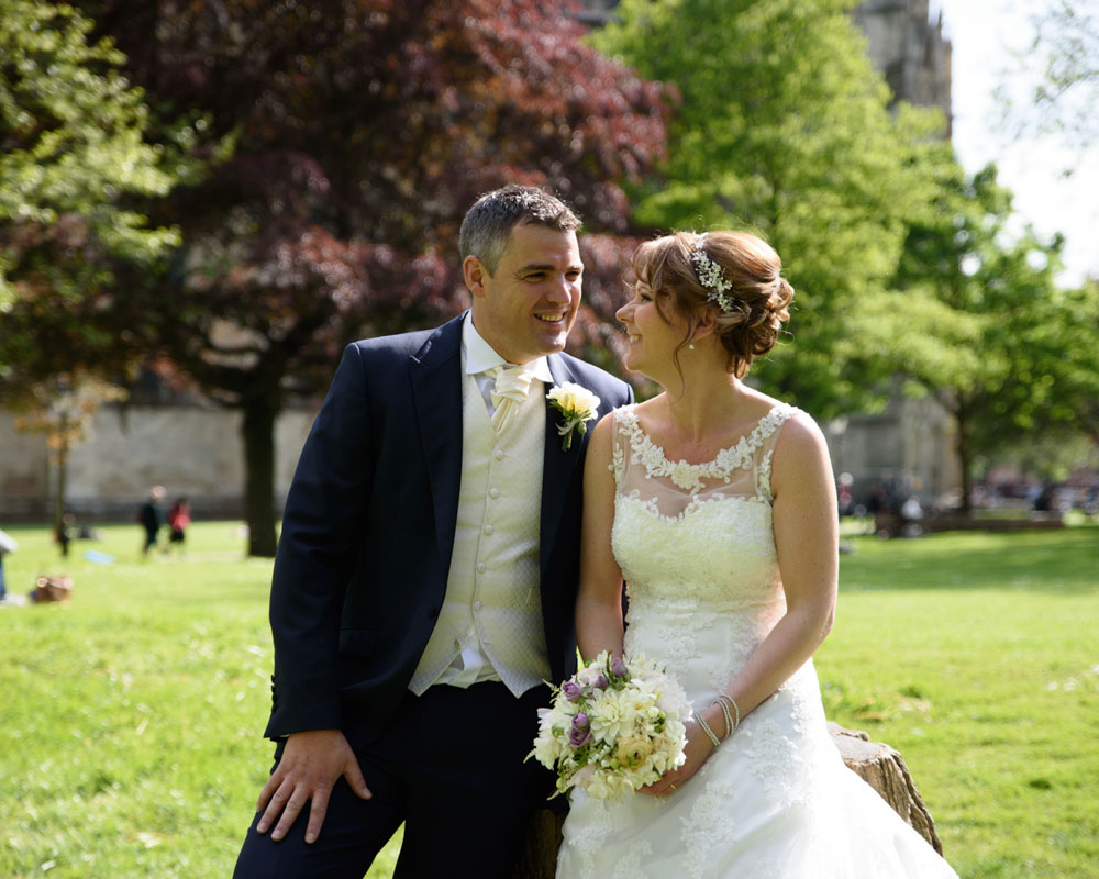 Close-up of the couple smiling naturally during their portrait session.
