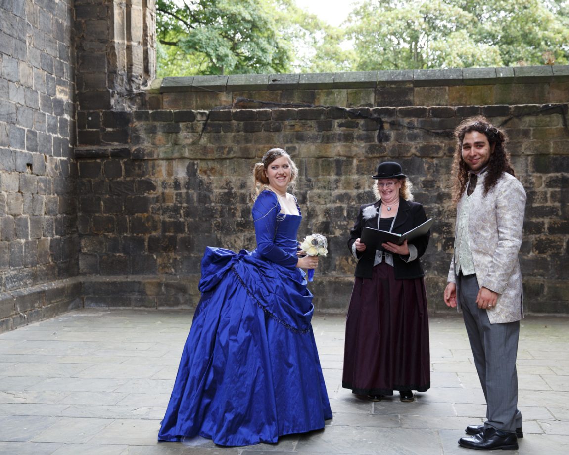 054 couple look towards guests kirkstall abbey wedding linsey and chris