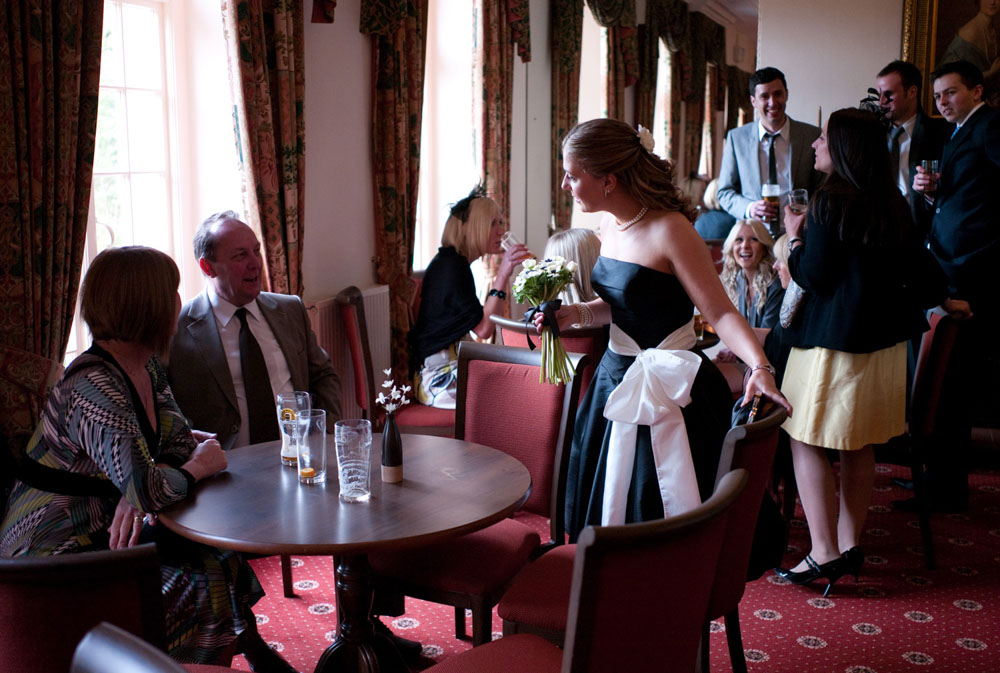 Guests quietly chatting and drinking in the bar area