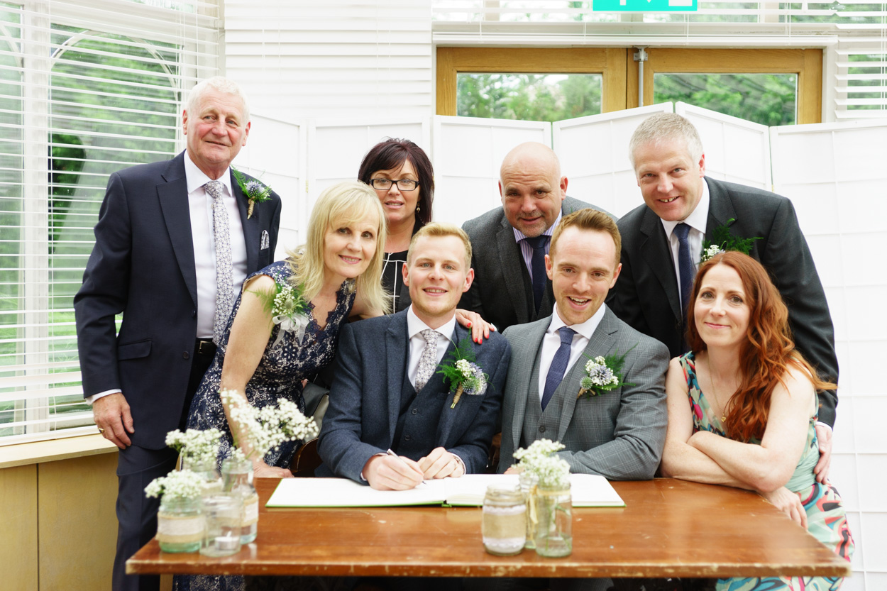 Wedding couple smiling naturally after signing the register