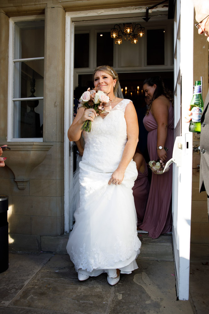 Tracy steps out into the gardens through the venue doors