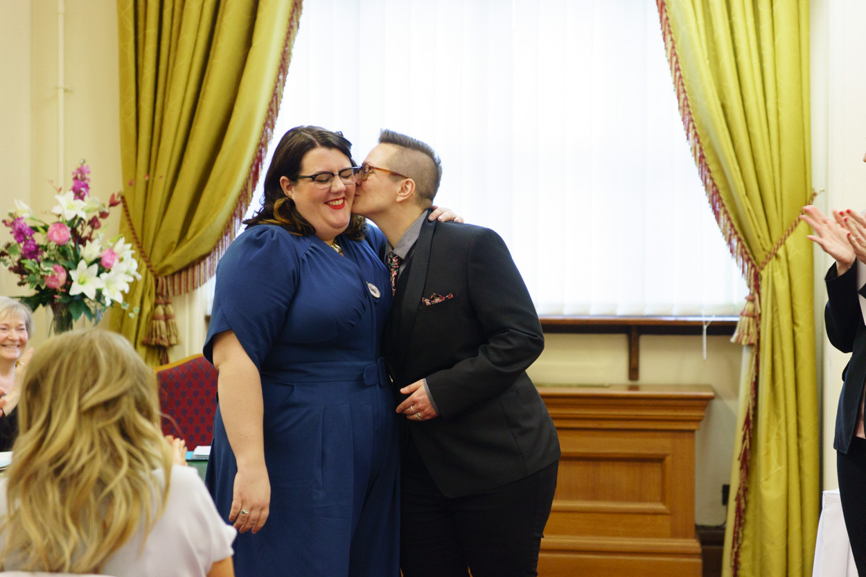 Tamara kissing Lizzie on the cheek