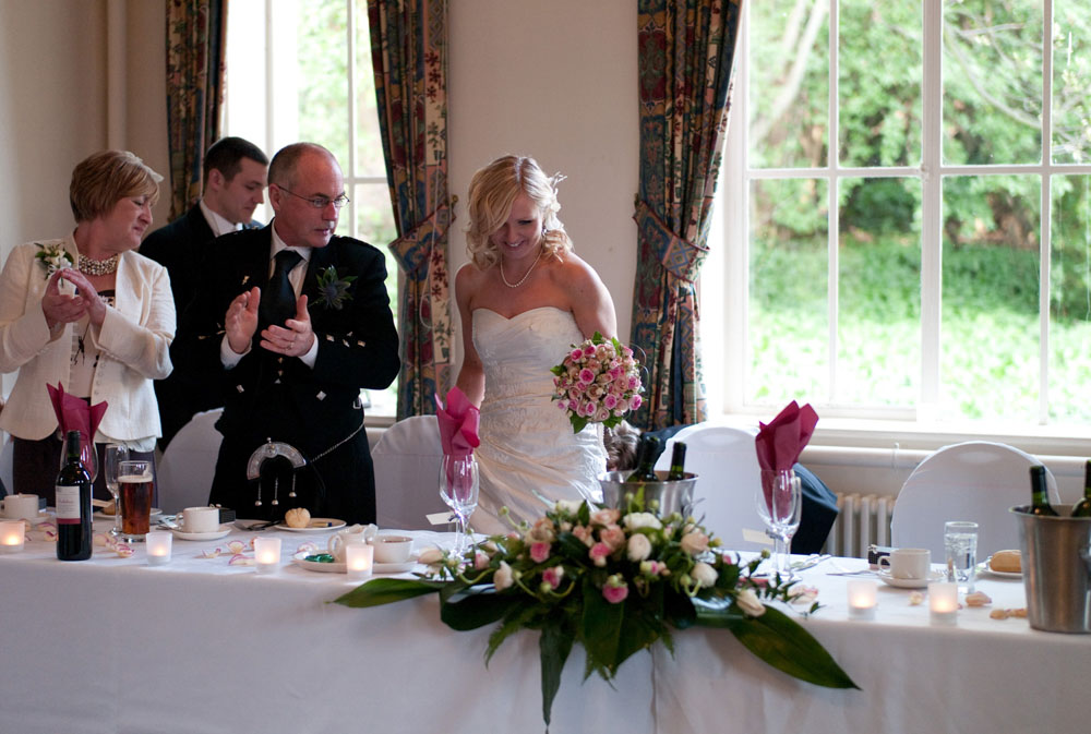Dani and Scott arrive at the top table to applause at Hoyle Court