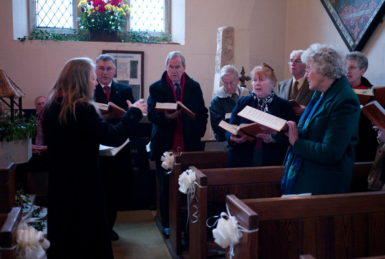 The choir sings warmly on this chilly winter day.