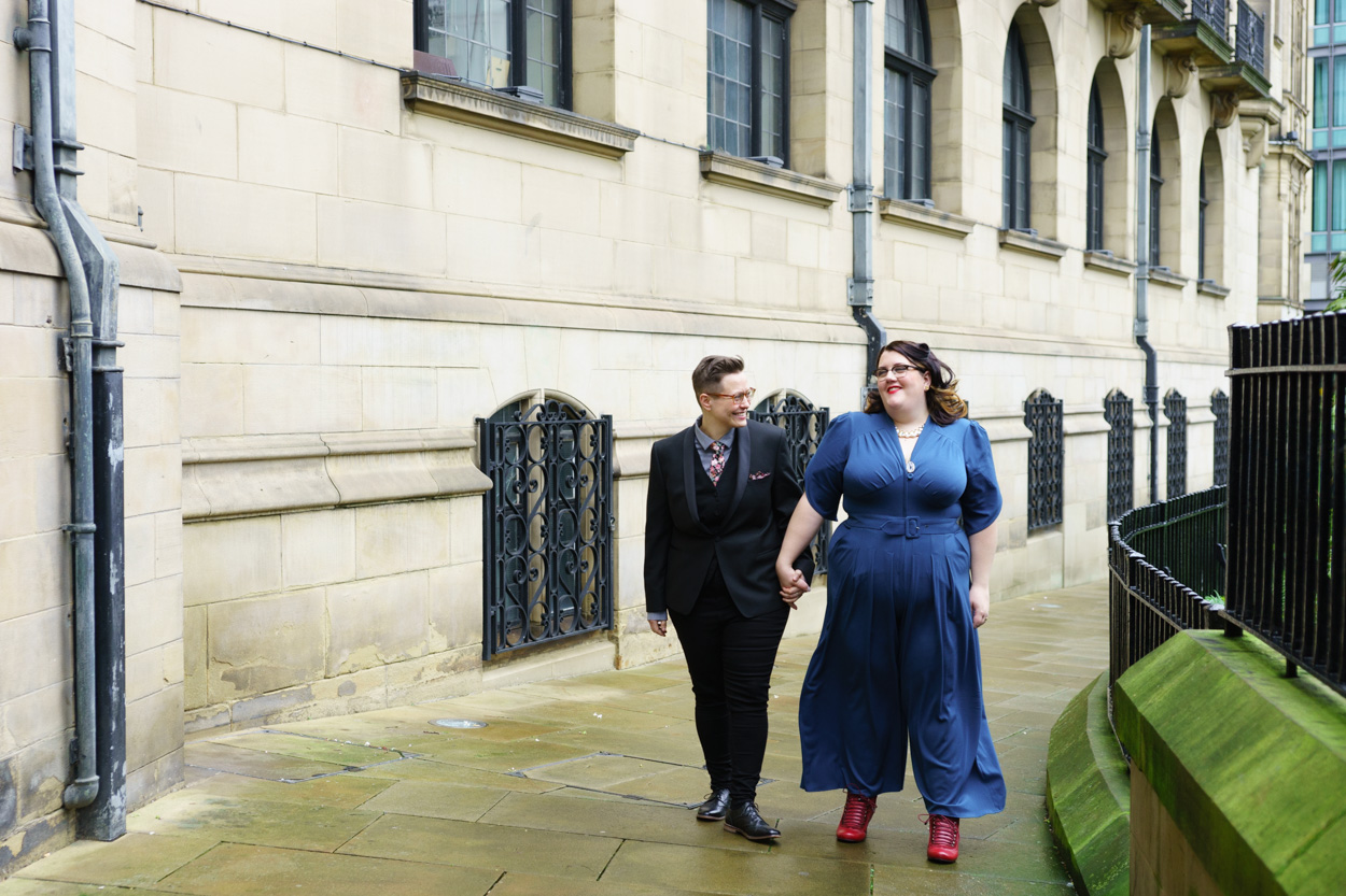 Couple smiling at each other while walking together