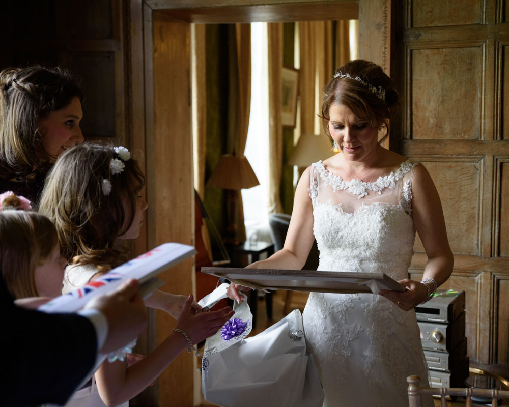 Groom shows off a handmade book titled ‘Wedding of the Year’.