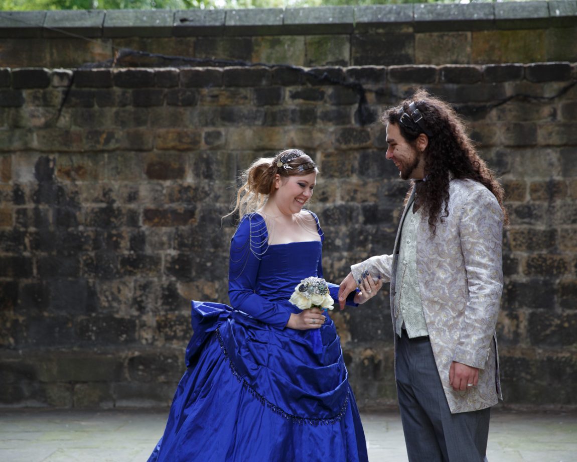 059 they admire each others wedding rings kirkstall abbey wedding linsey and chris