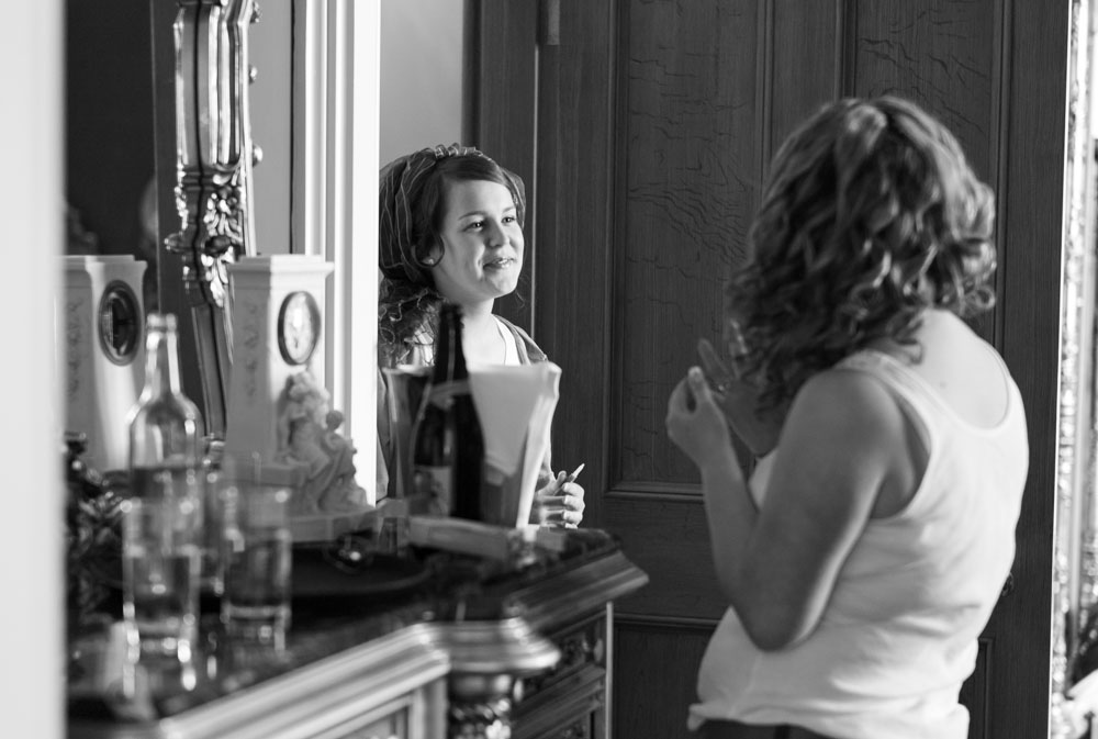 Sisters smiling at each other in black and white - reportage moments captured during prep