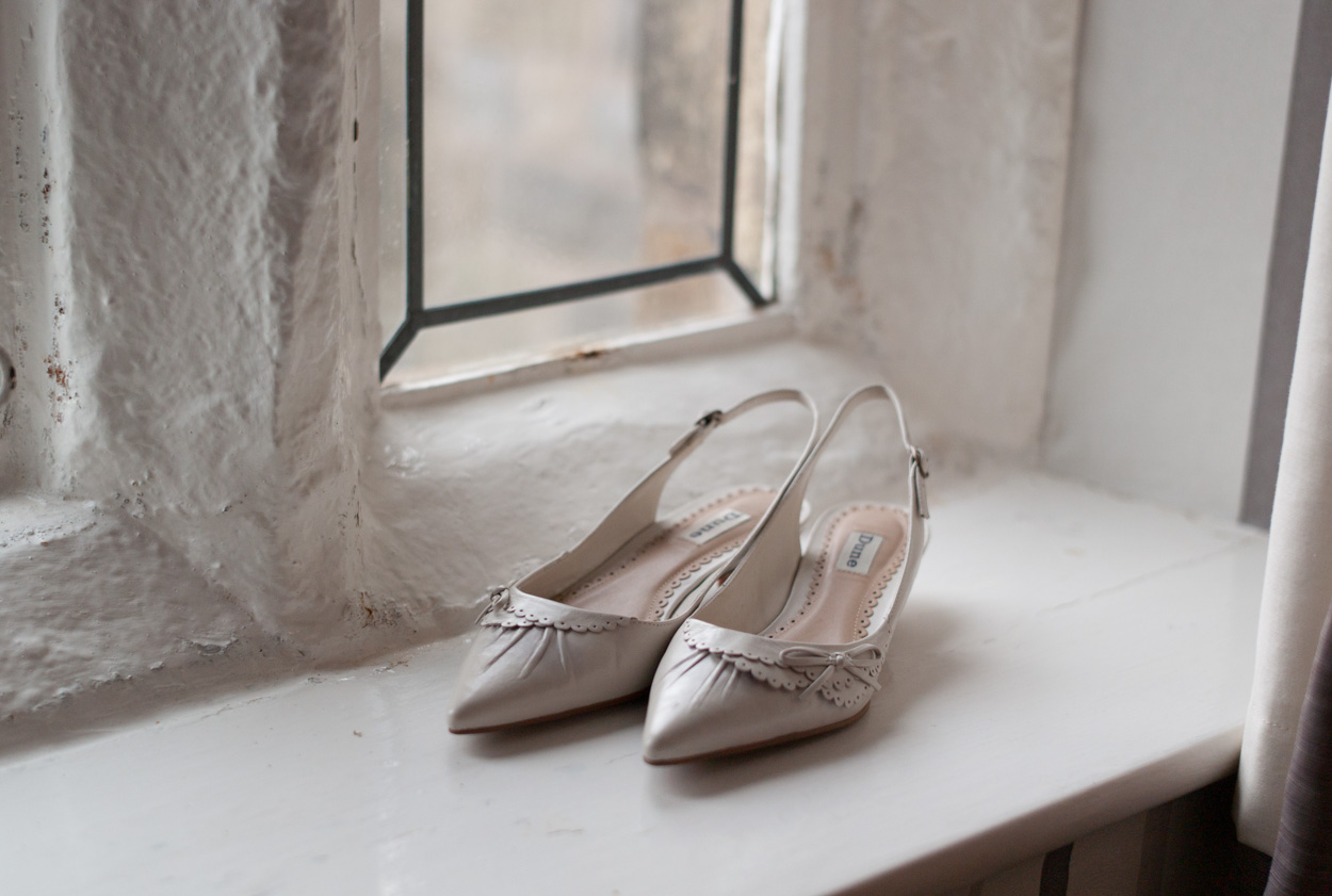 Bridal shoes on the stone window sill at Stirk House