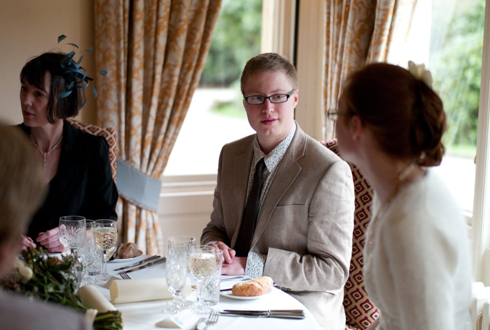 Groom Philip in natural April light, soft documentary portrait at Weetwood Hall.