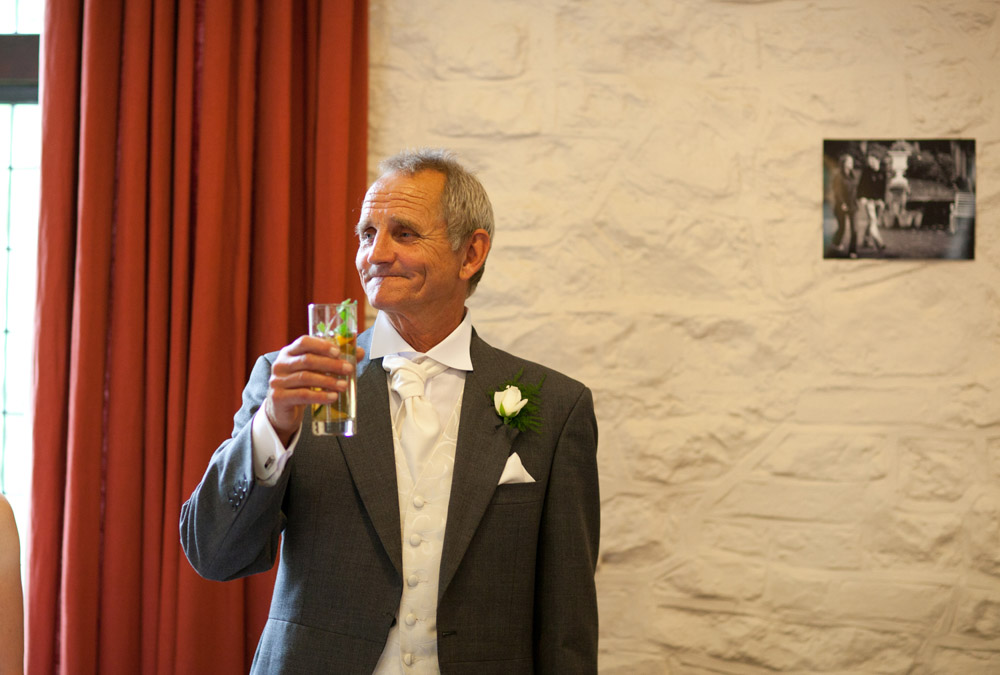 Father of the bride raises a toast to the couple