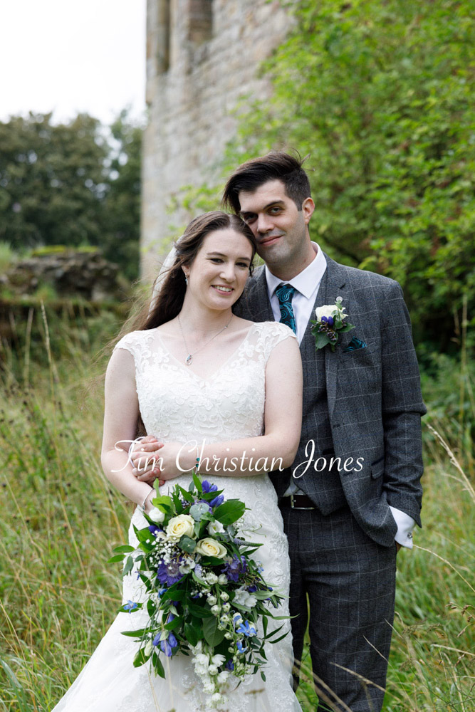 Close, emotional moment between bride and groom.