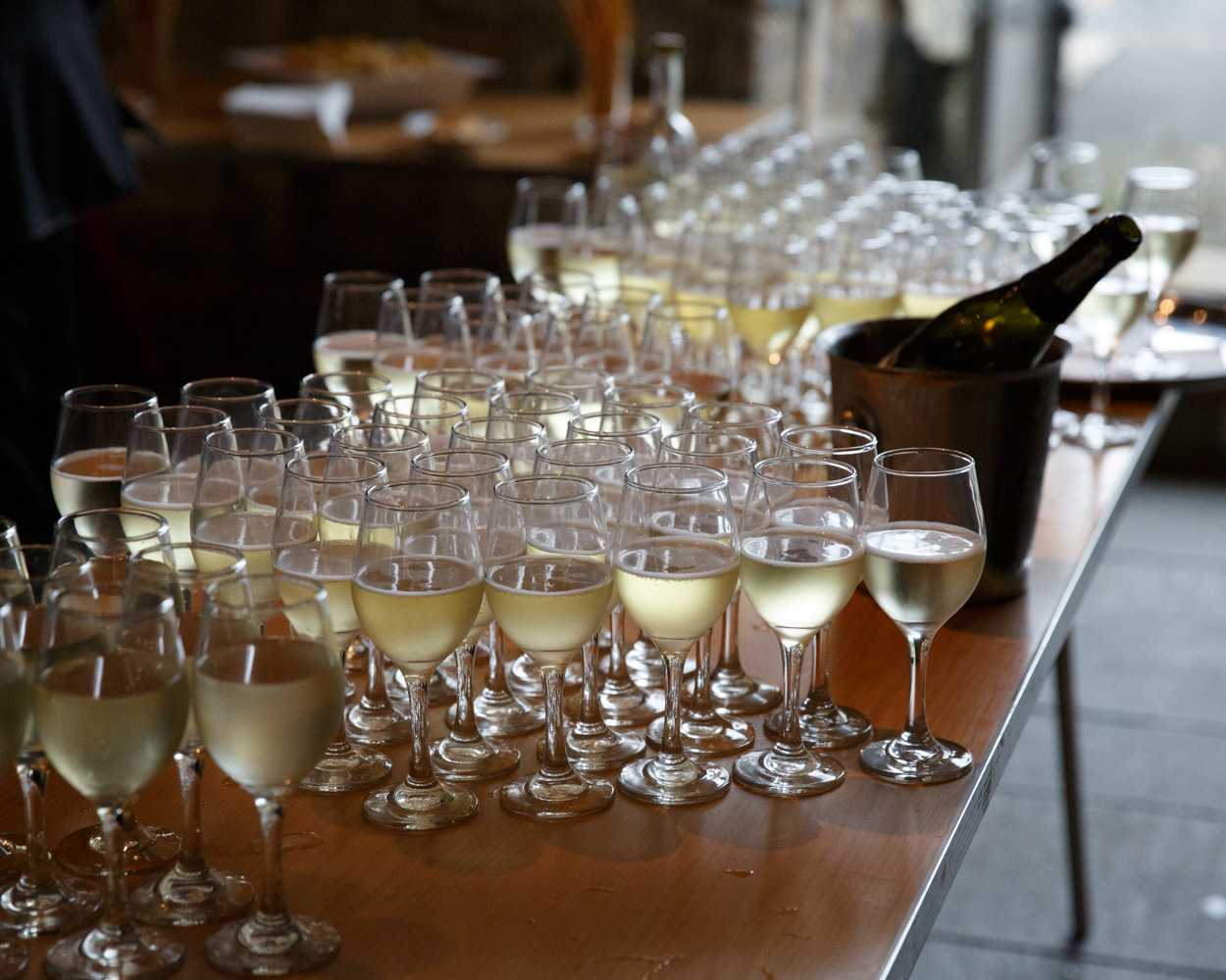 Champagne glasses wait on a table inside the Abbey café as celebrations begin