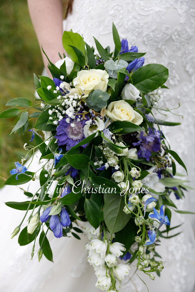 Elegant bridal moment with bouquet in hand.